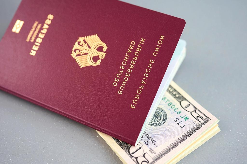 Hands holding smartphone with travel documents app