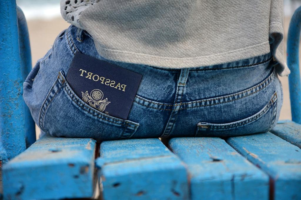 Northern lights over Reykjavik harbor with colorful houses